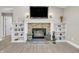 Close-up of the fireplace with stone surround, built-in shelves, and decorative accents at 10174 N County Road 471 E, Pittsboro, IN 46167