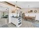 Kitchen with a vaulted ceiling and an island with seating looking into an adjacent dining area at 10174 N County Road 471 E, Pittsboro, IN 46167