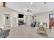 Inviting living room featuring built-in shelving, a fireplace, hardwood flooring, and a comfortable seating area at 10174 N County Road 471 E, Pittsboro, IN 46167