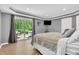 Main bedroom with a sliding glass door with access to a patio with hot tub at 10174 N County Road 471 E, Pittsboro, IN 46167