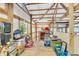 Unfinished storage space with exposed beams provides ample room for organizing belongings at 10174 N County Road 471 E, Pittsboro, IN 46167