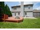 Enjoy this home's large backyard, partially enclosed by a wood fence and featuring a spacious wood deck and firepit at 10751 Sheffield Ct, Fishers, IN 46038