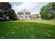 Enjoy this home's large backyard, partially enclosed by a wood fence and featuring a spacious wood deck at 10751 Sheffield Ct, Fishers, IN 46038