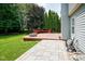 Enjoy this home's large backyard, partially enclosed by a wood fence and featuring a spacious wood deck with a firepit at 10751 Sheffield Ct, Fishers, IN 46038