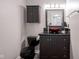 Unique powder room featuring a bowl sink, dark wood cabinets, and modern fixtures at 10751 Sheffield Ct, Fishers, IN 46038