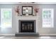 Close-up of a stylish fireplace featuring white trim and a decorative mantel at 10751 Sheffield Ct, Fishers, IN 46038