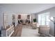 Bright and airy living room with ample natural light, neutral tones, and modern furnishings at 10751 Sheffield Ct, Fishers, IN 46038