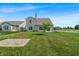 Well-maintained backyard with green grass and a young tree at 10917 Hunter Lake Ln, Indianapolis, IN 46239