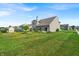 Spacious backyard with lush green grass and mature tree at 10917 Hunter Lake Ln, Indianapolis, IN 46239