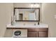 Contemporary bathroom vanity with a sleek countertop and a decorative mirror at 10917 Hunter Lake Ln, Indianapolis, IN 46239