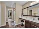 Bright bathroom with a modern vanity, mirror, and a walk-in shower at 10917 Hunter Lake Ln, Indianapolis, IN 46239