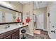 Modern bathroom featuring sleek vanity, tile flooring, and a glass-enclosed shower at 10917 Hunter Lake Ln, Indianapolis, IN 46239