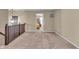 Upstairs hallway featuring neutral walls and carpet, leading to other bedrooms at 10917 Hunter Lake Ln, Indianapolis, IN 46239