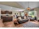 Open-concept living area with hardwood floors connects the kitchen and Gathering room at 10917 Hunter Lake Ln, Indianapolis, IN 46239