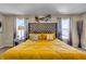 Bright main bedroom with a large bed, plush bedding, and lots of natural light at 10917 Hunter Lake Ln, Indianapolis, IN 46239