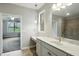 Spacious bathroom features a marble vanity, a large mirror, natural light, and access to the shower and bedroom at 1127 Kay Dr, Greenwood, IN 46142