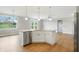 Kitchen island with stainless steel appliances, granite countertops and a view to the dining room perfect for seamless entertaining at 1127 Kay Dr, Greenwood, IN 46142