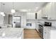 Stylish kitchen with stainless steel appliances, granite countertops, and ample white cabinetry offering a modern design at 1127 Kay Dr, Greenwood, IN 46142