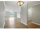 Open-concept living room boasts hardwood floors and doors leading to the backyard at 1127 Kay Dr, Greenwood, IN 46142