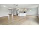 Open-concept living area features hardwood floors, kitchen with island, and ample natural light at 1127 Kay Dr, Greenwood, IN 46142