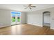 Bright, open living room with hardwood floors and a door to the outside and neutral decor at 1127 Kay Dr, Greenwood, IN 46142