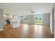 Open living space with hardwood floors, a kitchen island, and backyard access at 1127 Kay Dr, Greenwood, IN 46142
