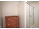 Walk-in shower with glass doors accompanied by a wooden dresser with hardware at 11624 Buttonwood Dr, Carmel, IN 46033