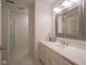 Bathroom with white vanity, neutral walls, framed mirror, and a glass-enclosed walk-in shower at 11624 Buttonwood Dr, Carmel, IN 46033