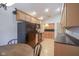 Well-maintained kitchen with wood cabinets, black appliances, and wood floors at 11624 Buttonwood Dr, Carmel, IN 46033