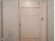 This bathroom boasts a tile shower stall with glass door and chrome shower head fixture at 11624 Buttonwood Dr, Carmel, IN 46033