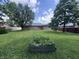 Spacious backyard with mature trees and lush green lawn at 1206 Brownswood Dr, Brownsburg, IN 46112
