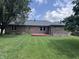 Expansive backyard featuring lush lawn and a wood deck at 1206 Brownswood Dr, Brownsburg, IN 46112
