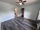 Bedroom with light-colored walls, modern gray floors, and access to closet at 1206 Brownswood Dr, Brownsburg, IN 46112