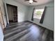 Bedroom with built-in closet shelving, modern flooring, and bright window at 1206 Brownswood Dr, Brownsburg, IN 46112