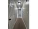 Hallway with neutral paint, carpet flooring, and multiple doors at 1206 Brownswood Dr, Brownsburg, IN 46112