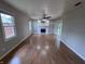 Inviting living room with hardwood floors, fireplace, built-in shelving and sliding glass door at 1206 Brownswood Dr, Brownsburg, IN 46112