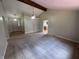 Open-concept living room featuring vaulted ceilings and carpet at 1206 Brownswood Dr, Brownsburg, IN 46112