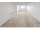 Bright basement featuring new carpet, white walls, and a well-lit window, perfect for a cozy and inviting atmosphere at 13019 Pinner Ave, Fishers, IN 46037