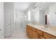 Bathroom featuring a double vanity, large mirror, and a glass-enclosed shower at 13019 Pinner Ave, Fishers, IN 46037