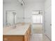 Bathroom featuring a double vanity, large mirror, and view of another bedroom at 13019 Pinner Ave, Fishers, IN 46037