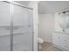 Bathroom featuring tile flooring, a shower with sliding glass doors, and a vanity sink with storage cabinets at 13019 Pinner Ave, Fishers, IN 46037