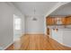 Open dining room with hardwood floors that connects to the kitchen area at 13019 Pinner Ave, Fishers, IN 46037