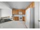 Bright kitchen featuring modern appliances, light wood cabinets, and a breakfast bar at 13019 Pinner Ave, Fishers, IN 46037