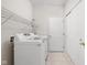 Laundry room featuring a washer, dryer, and wire shelving above at 13019 Pinner Ave, Fishers, IN 46037