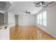 Bright and open living room showcasing hardwood floors and modern lighting at 13019 Pinner Ave, Fishers, IN 46037