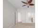 Spacious bedroom with a ceiling fan and an open doorway to the bathroom at 13019 Pinner Ave, Fishers, IN 46037