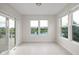 Sunroom with large windows offering scenic views of the lake at 13019 Pinner Ave, Fishers, IN 46037
