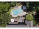 Aerial view of a stunning pool and deck area, surrounded by lush greenery at 14027 Waterway Blvd, Fishers, IN 46040