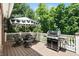 This outdoor deck area is perfect for entertaining and includes a grill and outdoor seating at 14027 Waterway Blvd, Fishers, IN 46040