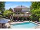 Stunning backyard oasis with an in-ground pool, expansive deck, and well-maintained landscaping, perfect for relaxation at 14027 Waterway Blvd, Fishers, IN 46040